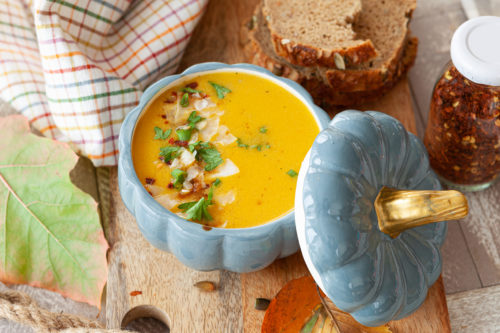 Rustic pumpkin soup with coconut and parsley
