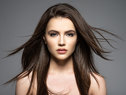 Brunette woman with beauty long brown hair. Fashion model with long straight hair. Fashion model posing at studio.
Pretty woman with long straight brown hair looking at camera.