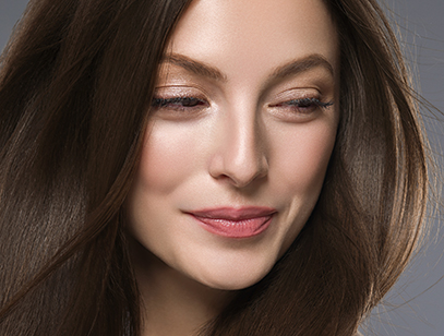 Beautiful hair woman long brunette hair beuty skin make up. Studio shot.